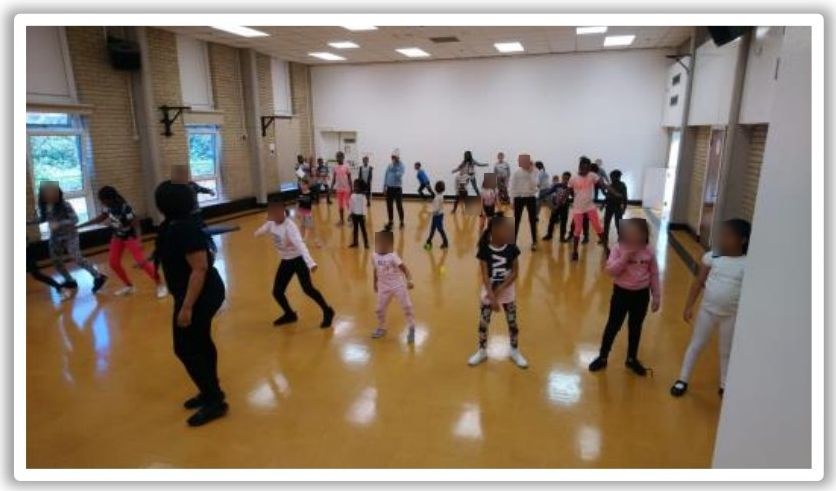 Children learning a dance routine at the AFC Wimbledon Foundation summer programme